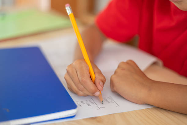 istock Close-Up Of A Primary School Child's Hand Doing Math Homework. Back To School. 2152284519
