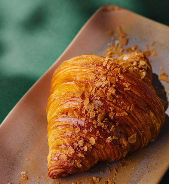 Gourmet croissant on ceramic plate