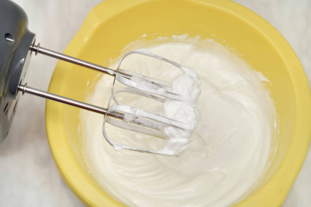 istock Whipped egg white cream with electrical hand mixer 2152285722