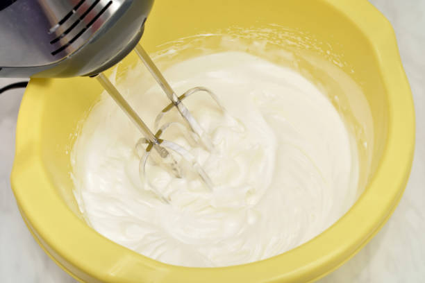 istock Mixing egg white cream with electrical hand mixer 2152285724