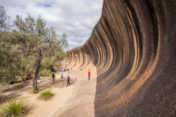 istock Wave Rock - Natural rock scuplped by time into a colossal ochre wave 2152287074