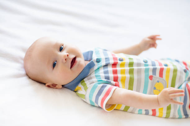 istock Little baby on white bed 2152287839