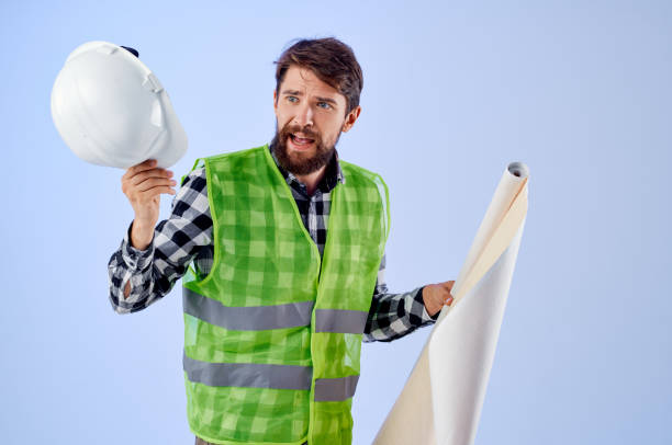 istock engineer in a white helmet blueprints Professional studio industry 2152291564