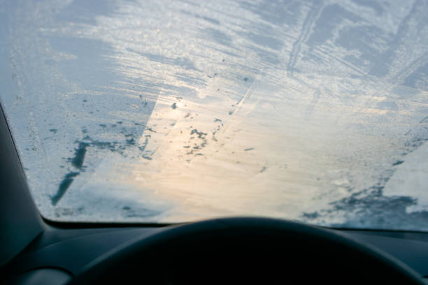 Inside view of a frozen car windshield on a winter day