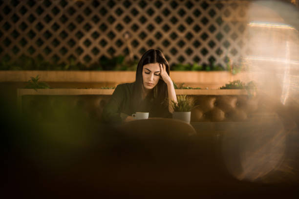 istock Sad woman sitting at cafe. 2152294451