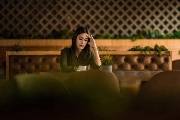istock Sad woman sitting at cafe. 2152294465