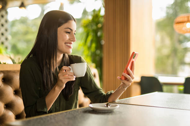 istock Happy woman enjoying coffee time at cafe. 2152294578