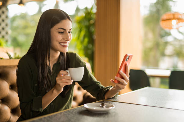 istock Happy woman enjoying coffee time at cafe. 2152294610