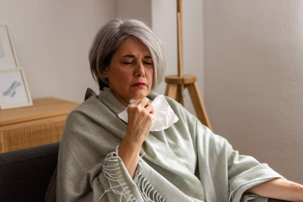 istock Senior woman feeling unwell at home 2152294847