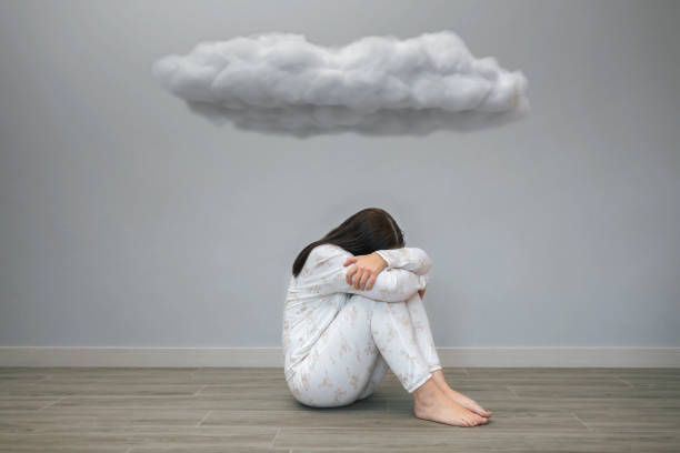 istock Woman with mental disorder and suicidal thoughts crying under a dark cloud 2152295109