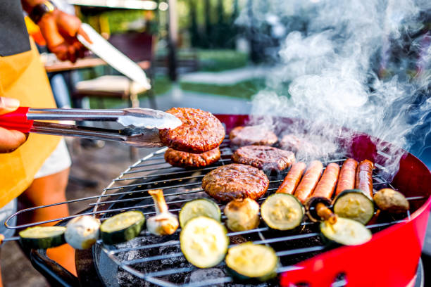 istock Man barbecuing meat in the garden 2152295579