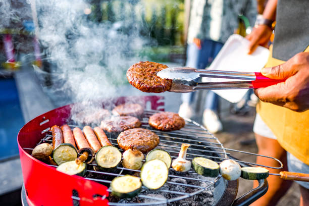 istock Man barbecuing meat in the garden 2152295610