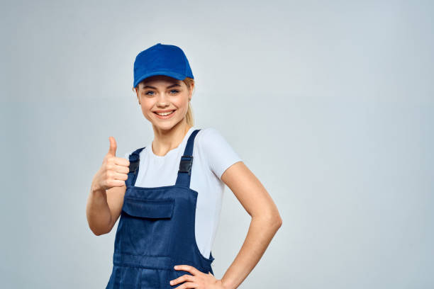 istock Woman in working uniform blue cap service lifestyle service 2152296816