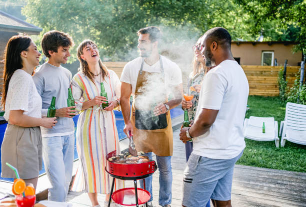 istock Friends having a barbecue party in a backyard 2152297128