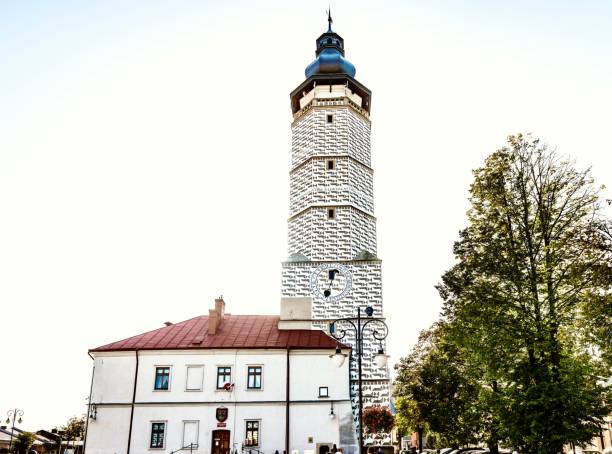 Decorated with geometric patterns, the ancient tower of the town hall, rising above the market square of the Polish city of Biecz in the Lesser Poland Voivodeship.