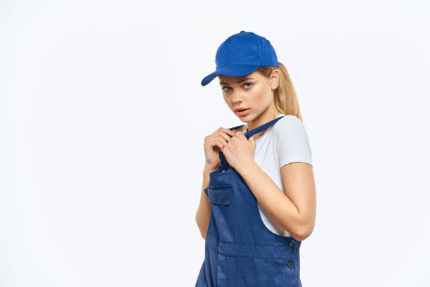 istock Woman in working uniform blue cap delivery courier delivery service 2152297252