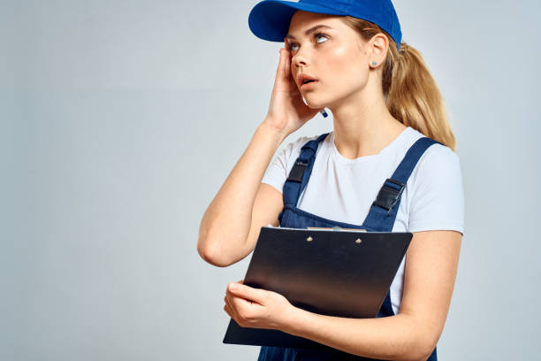 istock Working woman in uniform courier delivery service documents 2152297423