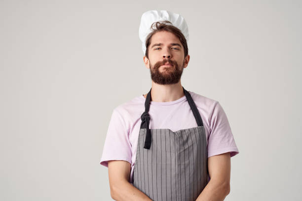 istock Cheerful male chef in uniform working professional kitchen 2152301378