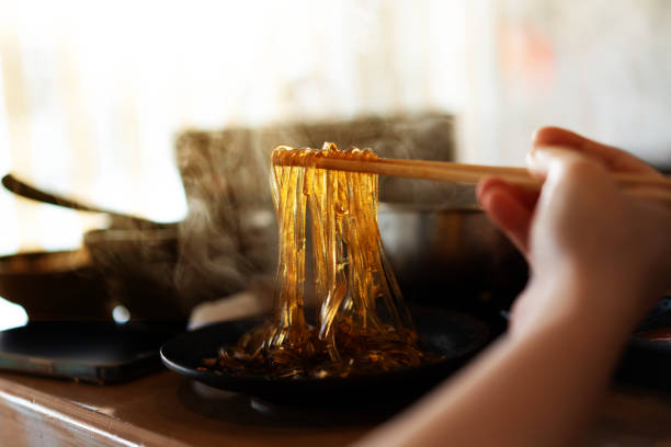 hot cooked glass noodle shabu with chopsticks