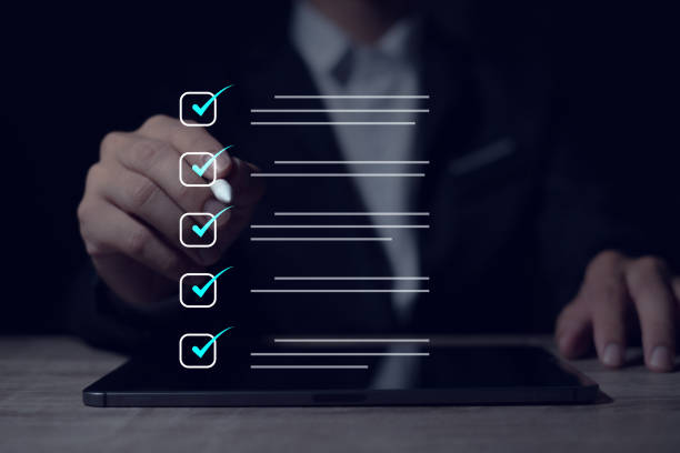 istock Complete the digital form checklist Businessman uses laptop to complete online checklist survey on virtual screen 2152301902