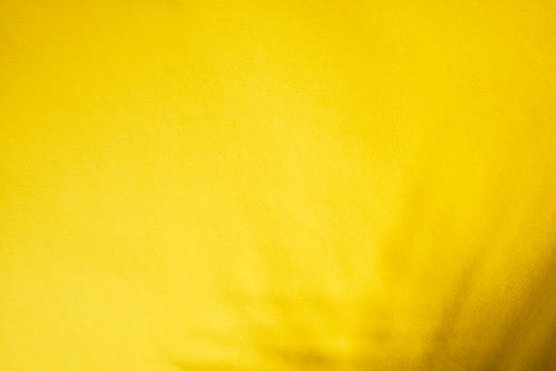 Yellow velvet fabric texture used as background. There is space for text.