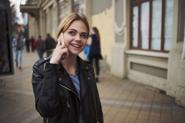Woman talking on the phone walk socializing lifestyle. High quality photo