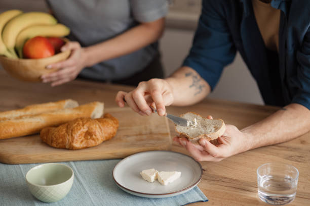 istock Spreading cream cheese on a slice of bread! 2152305211