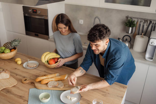 istock Above view of happy couple having breakfast in the kitchen. 2152305218
