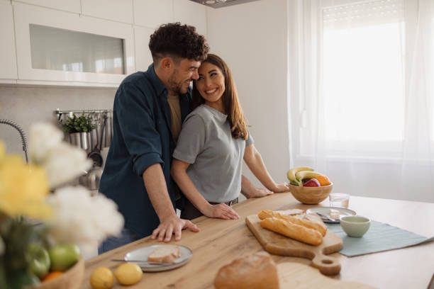 istock Happy couple in love talking during morning time in the kitchen. 2152305272