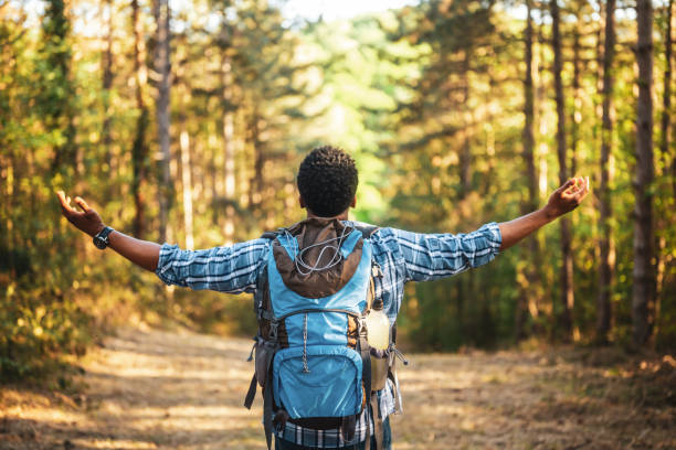 istock Hiker with arms raised enjoys in nature 2152305852