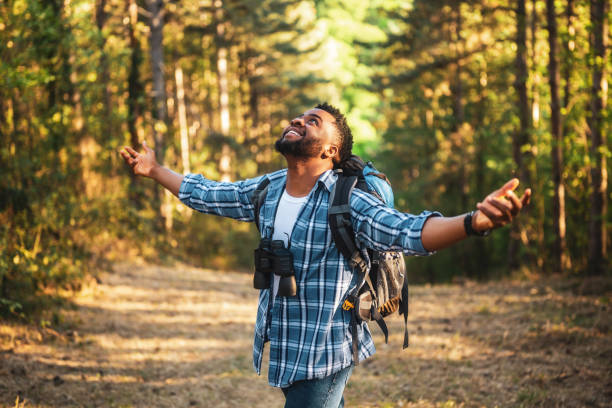 istock Hiker with arms raised enjoys in nature 2152305880
