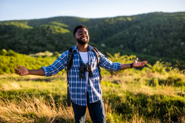 istock Hiker with arms raised enjoys in nature 2152305921