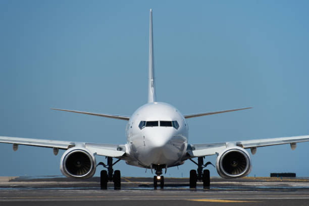 istock White passenger jet plane taxiing along the runway 2152306850