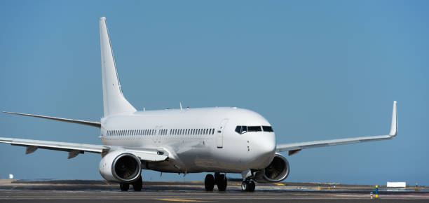 istock White passenger jet plane taxiing along the runway 2152306858
