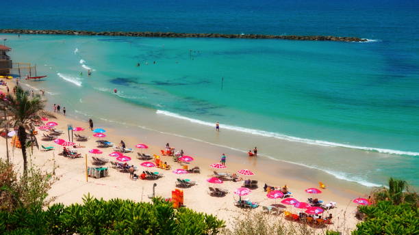 istock Aerial View Vibrant Turquoise Beach Crowded With Colorful Umbrellas 2152308188