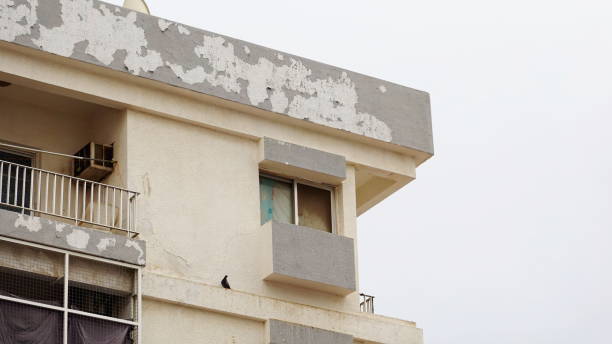 istock Weathered White Exterior Building Detail Close-Up 2152308231