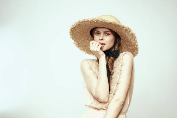 Pretty woman hat on her head smile Cosmetics Studio. High quality photo