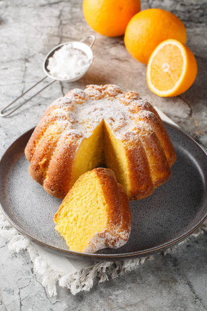 istock Moroccan Meskouta Orange Cake with powdered sugar close-up on a plate. Vertical 2152310473