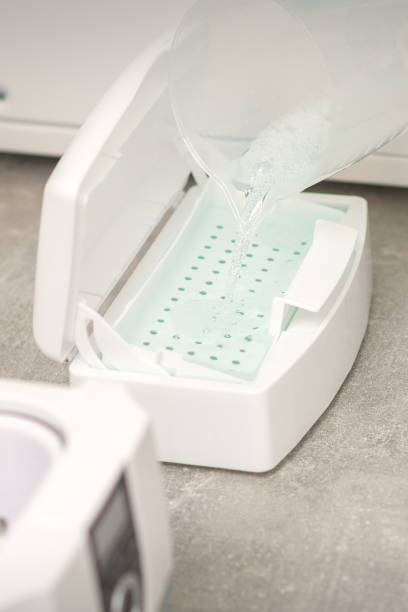 istock Adding liquid for disinfection of instruments to the machine for sterilization of tools. 2152310914