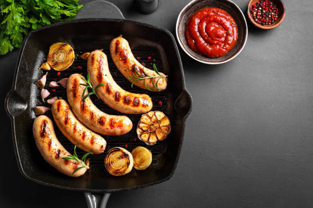 istock Grilled sausages on grill pan 2152311212