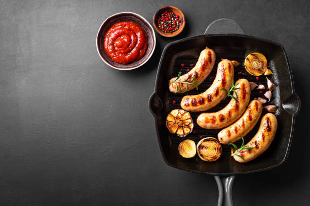 istock Grilled sausages on grill pan 2152311214