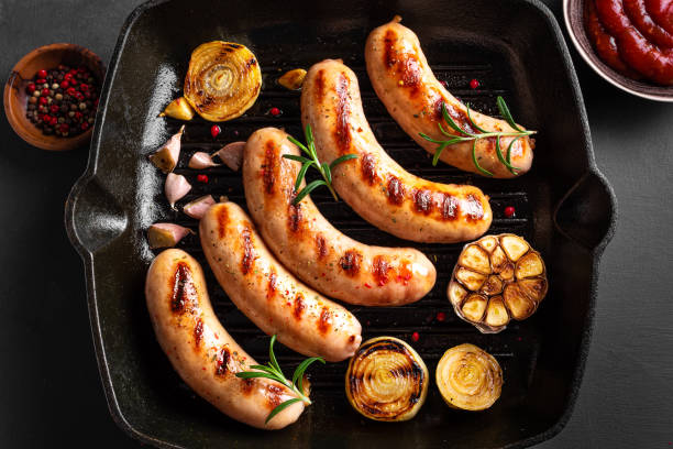 Grilled sausages on grill pan