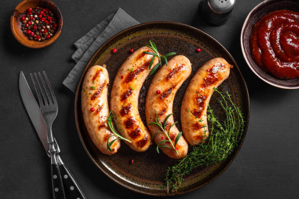 istock Grilled sausages with tomato sauce 2152311265