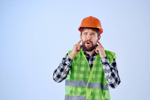 istock emotional man green vest orange helmet workflow hand gestures Studio 2152313544