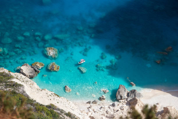 istock Boat in the blue lagoon in Greece 2152314078