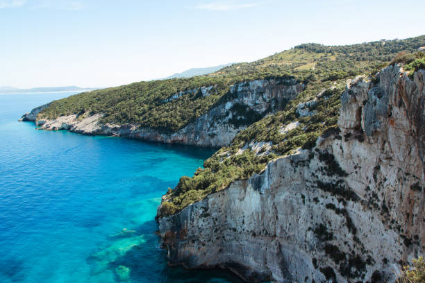Blue clear sea meeting rocky coastline on the greek island Zakynthos
