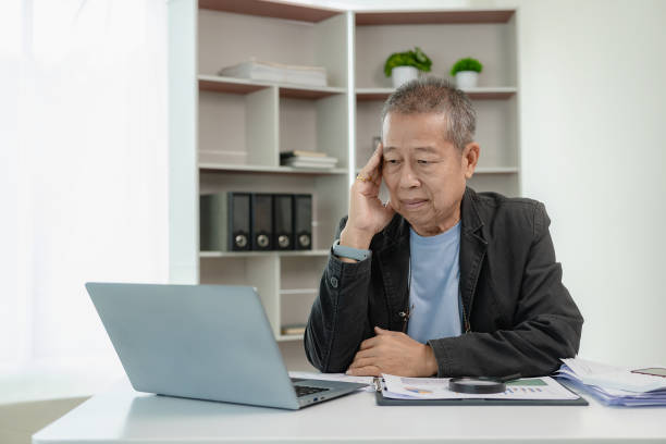 istock Financial data analysis, senior Asian businessman working with documents in office, having a meeting, video calling, management, technology for modern business remotely. 2152316268