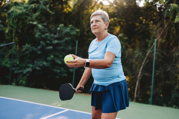 istock Senior woman playing pickleball 2152316409