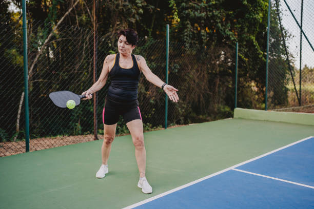 istock Woman serving in pickleball game 2152316421
