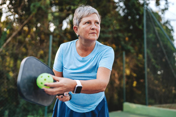 istock Senior woman playing pickleball 2152316454